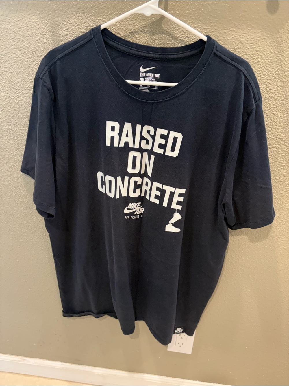Nike Black T‑Shirt with White 'Raised On Concrete' Graphic